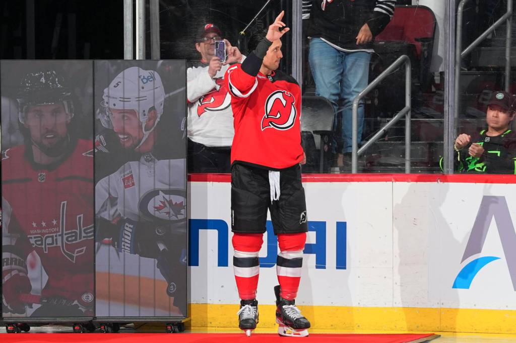 New Jersey Devils defenceman Brenden Dillon greeting the crowd while being honoured for playing his 1000th game in the NHL on Dec. 1, 2025. He achieved this during the New Jersey Devils&rsquo; game against the Columbus Blue Jackets. (NHL/New Jersey Devils/X/Twitter)