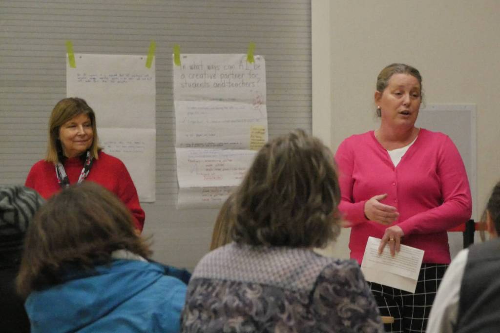 School District 19 superintendent Roberta Kubik, back left, and trustee Wendy Rota, back right, engage parents at Revelstoke Secondary School on Wednesday evening, March 11, about how artificial intelligence can successfully be used in local classrooms. (Evert Lindquist/Revelstoke Review)